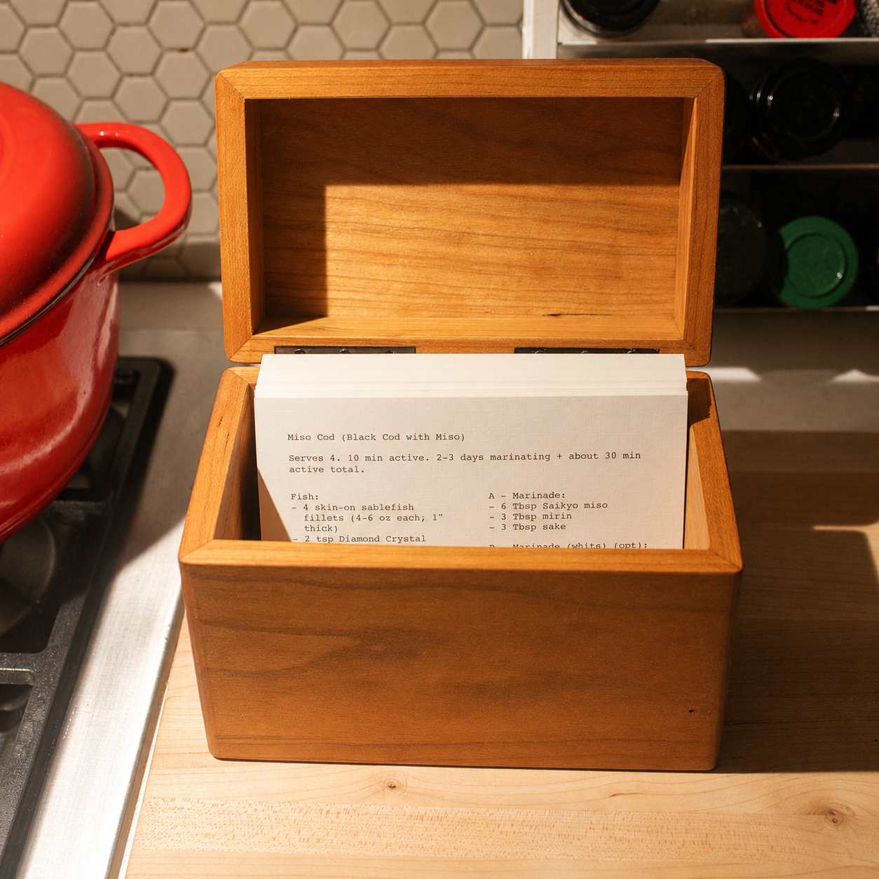 Open hardwood recipe box on a counter